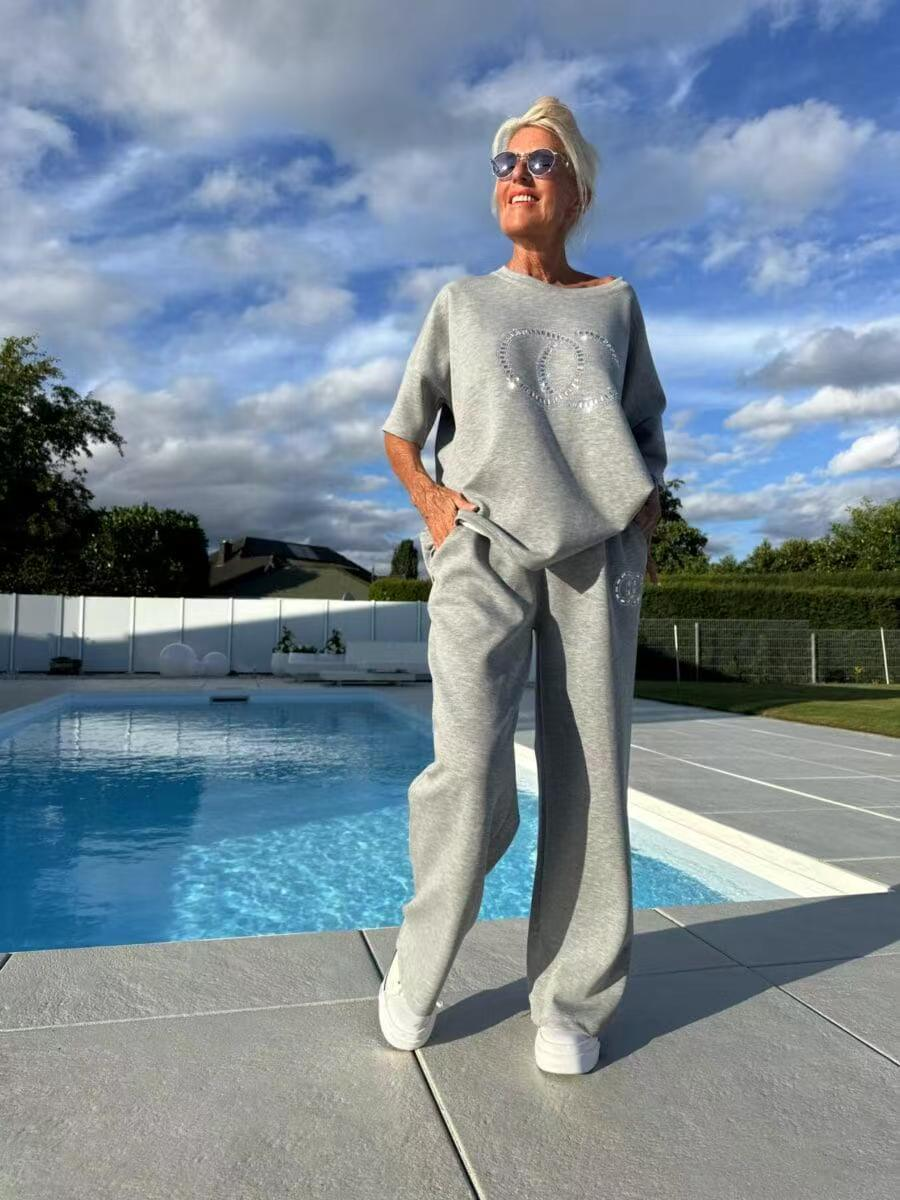 Women's casual two-piece set: solid color sweater paired with loose-fitting trousers