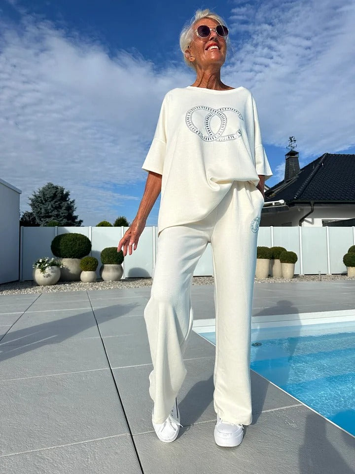 Women's casual two-piece set: solid color sweater paired with loose-fitting trousers