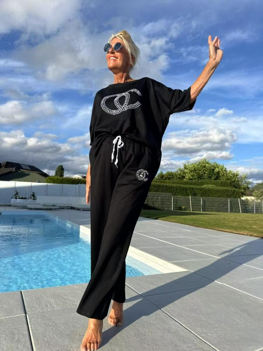 Women's casual two-piece set: solid color sweater paired with loose-fitting trousers